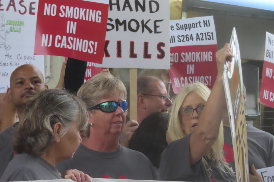Casino workers and patrons opposed to smoking in the gambling halls demonstrate outside the Hard Rock casino in Atlantic City N.J. on Sept. 22, 2022. On Tuesday, Dec. 12, 2023, casino workers pushing for a smoking ban at the city's nine casinos publicized a letter from Shawn Fain, international president of the United Auto Workers union, calling on New Jersey lawmakers to ban smoking in the casinos. (AP Photo/Wayne Parry)