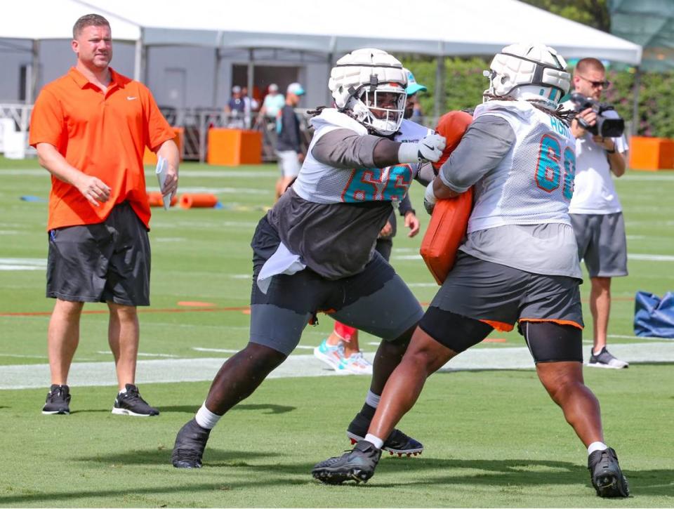 Miami Dolphins offensive line coach Matt Applebaum watches as offensive lineman Robert Hunt (68) and Soloman Kindley (66) run practice drills at Baptist Health Training Complex in Miami Gardens on Friday, July 29, 2022.