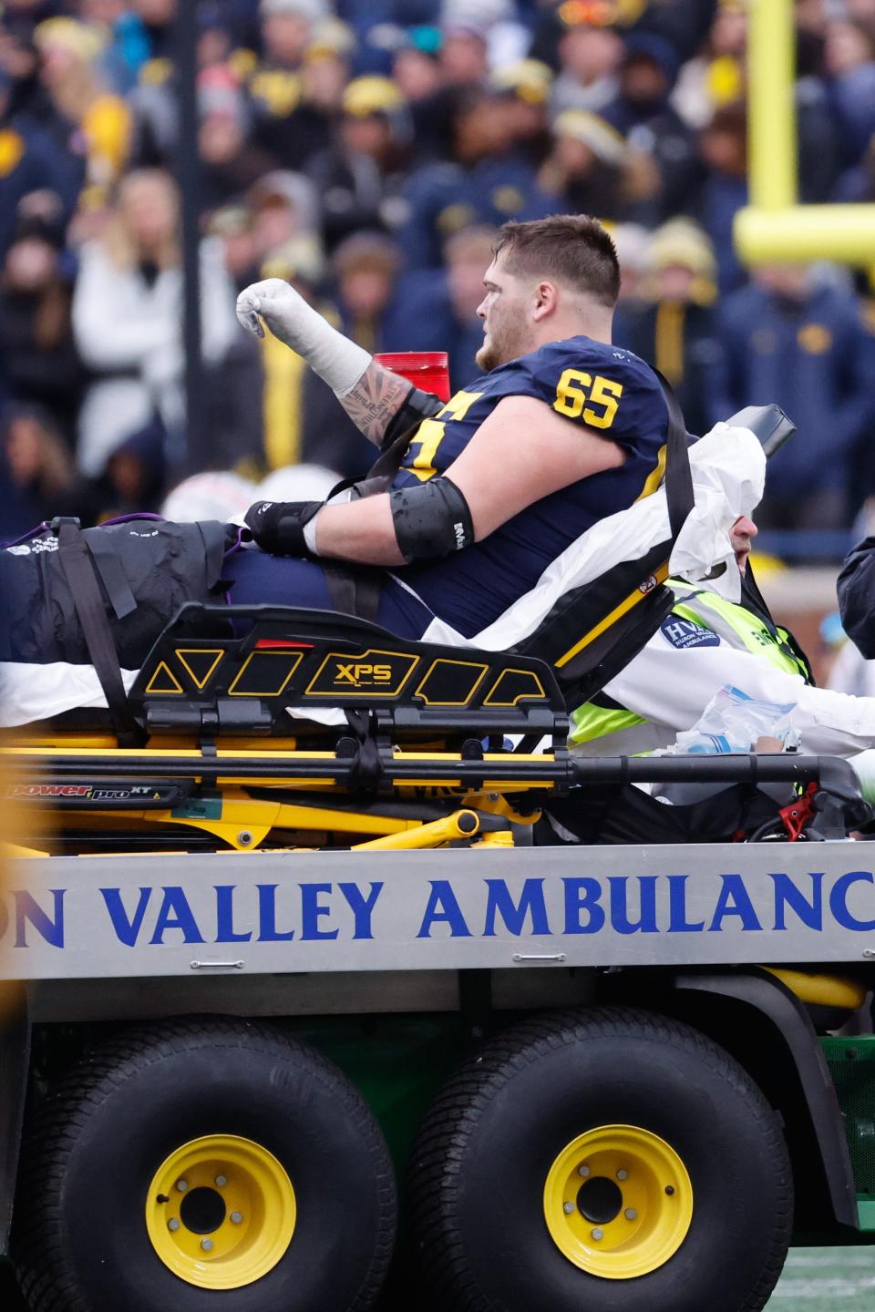 Michigan offensive lineman Zak Zinter is carted off the field after he is injured against Ohio State, Nov. 25, 2023, in Ann Arbor.