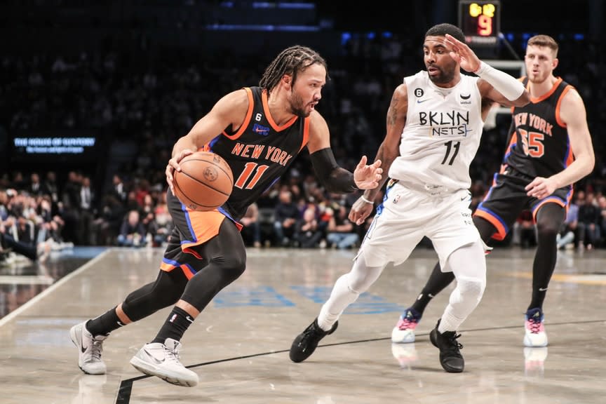 New York Knicks guard Jalen Brunson (11) looks to drive past Brooklyn Nets guard Kyrie Irving (11) in the second quarter at Barclays Center.