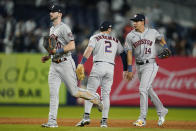 Houston Astros right fielder Kyle Tucker (30), third baseman Alex Bregman (2) and center fielder Mauricio Dubon (14) celebrate after the Astros defeated the New York Yankees 5-0 in Game 3 of an American League Championship baseball series, Saturday, Oct. 22, 2022, in New York. (AP Photo/John Minchillo)