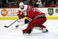 Detroit Red Wings' Lucas Raymond (23) waits for a pass near Carolina Hurricanes goaltender Frederik Andersen (31) during the first period of an NHL hockey game in Raleigh, N.C., Thursday, March 28, 2024. (AP Photo/Karl B DeBlaker)