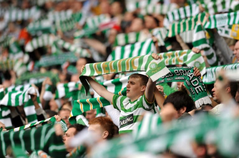 Celtic supporters sing before the Scottish Premier League football match at Celtic Park in Glasgow, Scotland