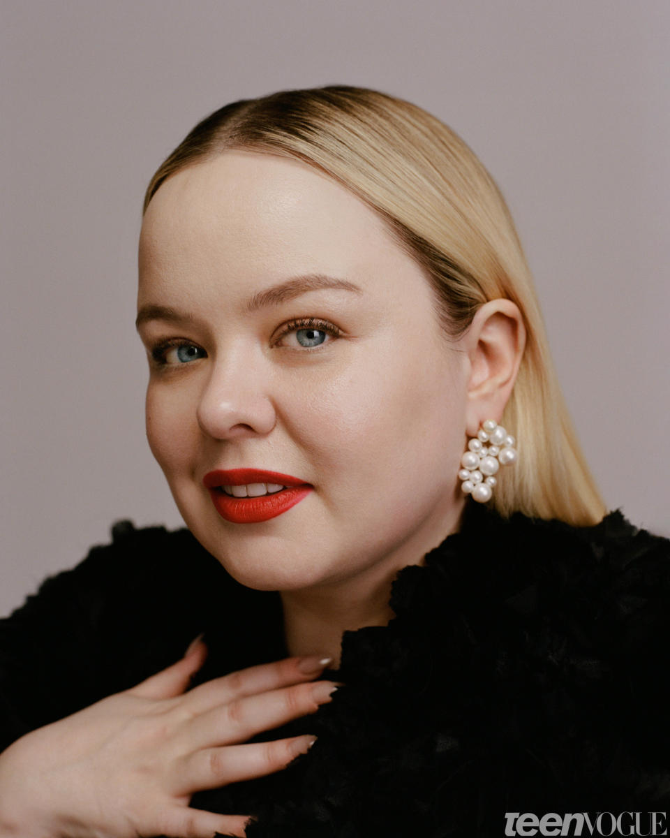 Nicola Coughlan wears an [Erdem coat](https://erdem.com) and Completedworks earrings.