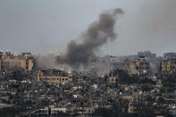 Smoke rises to the sky following an explosion in the Gaza Strip, as seen from southern Israel, Friday, March 8, 2024. (AP Photo/Leo Correa)