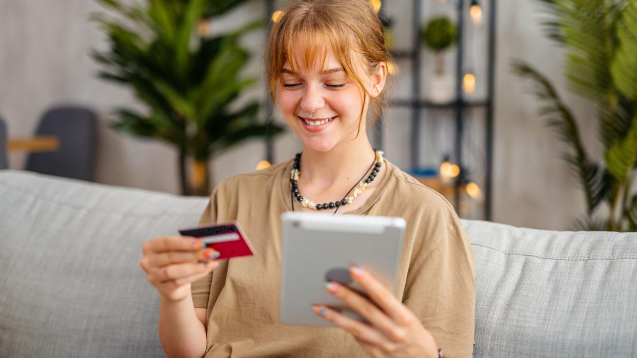 woman shopping online using digital tablet