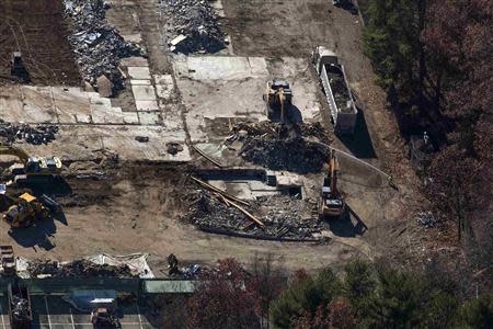 An aerial photo shows demolition work at Sandy Hook Elementary School in Newtown, Connecticut on November 13, 2013. REUTERS/Michelle McLoughlin