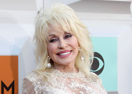 FILE PHOTO: Singer Dolly Parton arrives at the 51st Academy of Country Music Awards in Las Vegas, Nevada April 3, 2016. REUTERS/Steve Marcus/File Photo