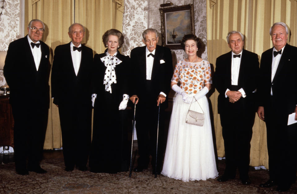 <p>The Queen with the prime minister Margaret Thatcher and her predecessors, from left to right, James Callaghan, Alec Douglas-Home, Harold Macmillan, Harold Wilson and Edward Heath, at 10 Downing Street on 4 December 1985. (PA)</p> 