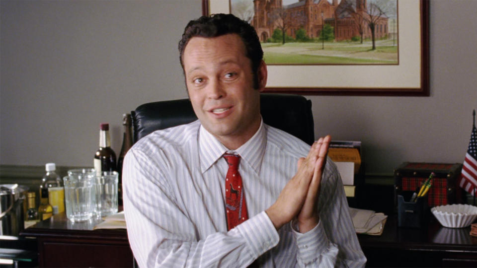 Vince Vaughn at desk in Wedding Crashers