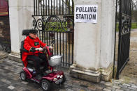 Chelsea Pensioners arrive at the polling station to vote in the General Election, in the Chelsea area of London, Thursday, Dec. 12, 2019. Voting is underway across the country in a general election that may resolve the stalemate over Brexit, widely seen as one of the most decisive votes in modern times. (AP Photo/Alberto Pezzali)