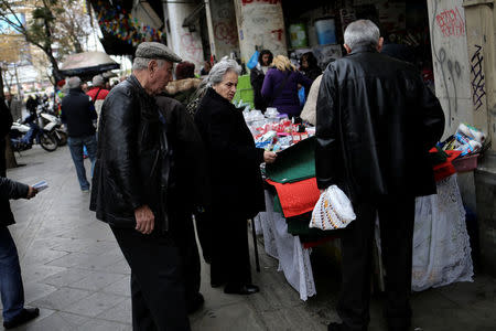 People shop on a main market street in central Athens, Greece, February 21. 2017. REUTERS/Alkis Konstantinidis