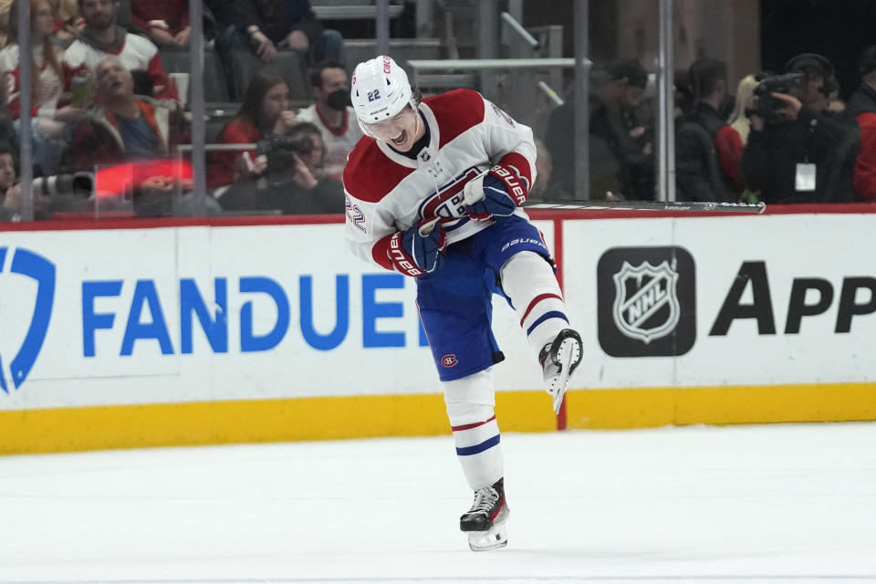 Montreal Canadiens right wing Cole Caufield (22) celebrates after scoring against the Detroit Red Wings in overtime during an NHL hockey game Thursday, Nov. 9, 2023, in Detroit. (AP Photo/Paul Sancya)