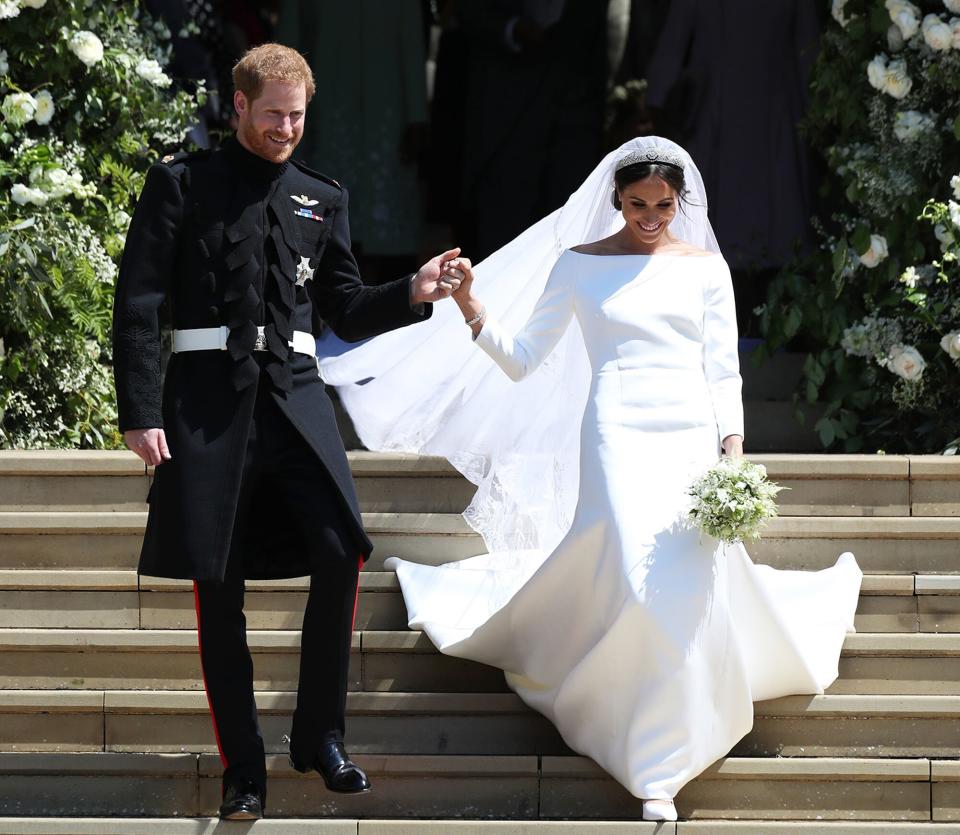 Prince Harry and Meghan Markle leave St George's Chapel after their wedding in St George's Chapel at Windsor Castle on May 19, 2018 in Windsor, England