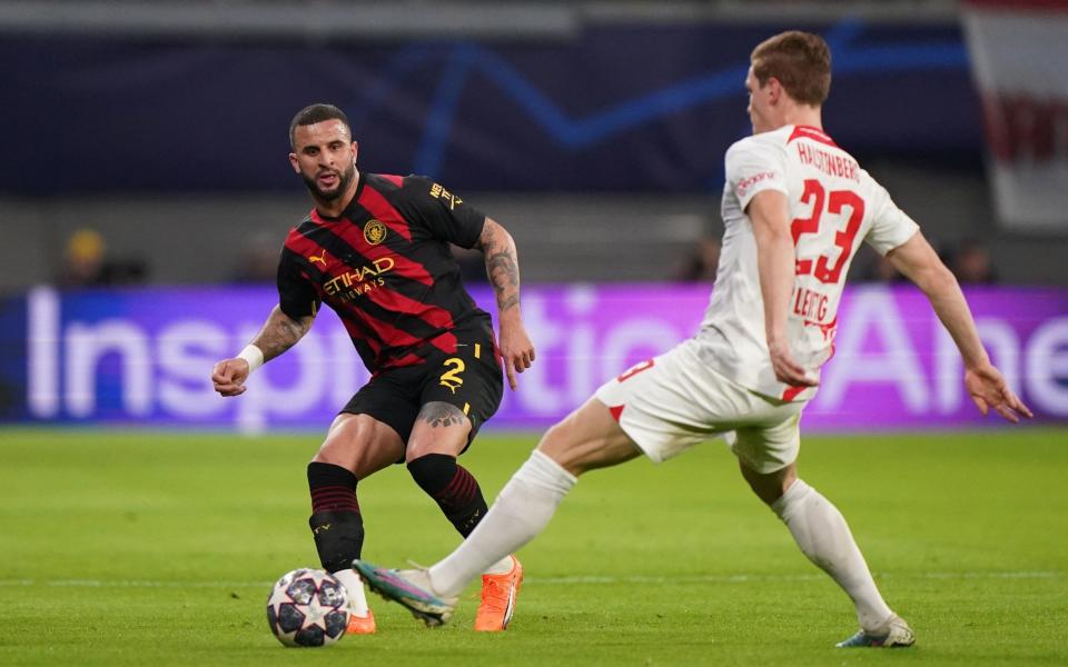 Manchester City's Kyle Walker (left) and RB Leipzig's Marcel Halstenberg in action during the Champions League round of 16 first leg match a - PA/Tim Goode