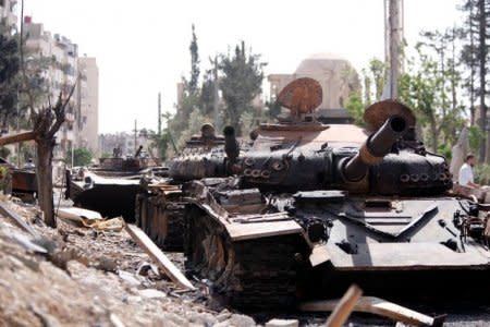 A damaged military vehicle is seen at the city of Douma in Damascus, Syria, April 20, 2018. REUTERS/Omar Sanadiki