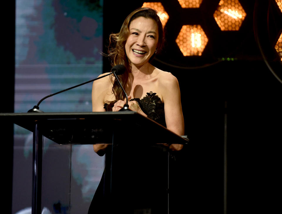 <p>Michelle Yeoh takes the stage at the Will Rogers Motion Picture Pioneers Foundation's 2022 Pioneer Dinner Honoring Barbara Broccoli and Michael G. Wilson at The Beverly Hilton on Sept. 21. </p>