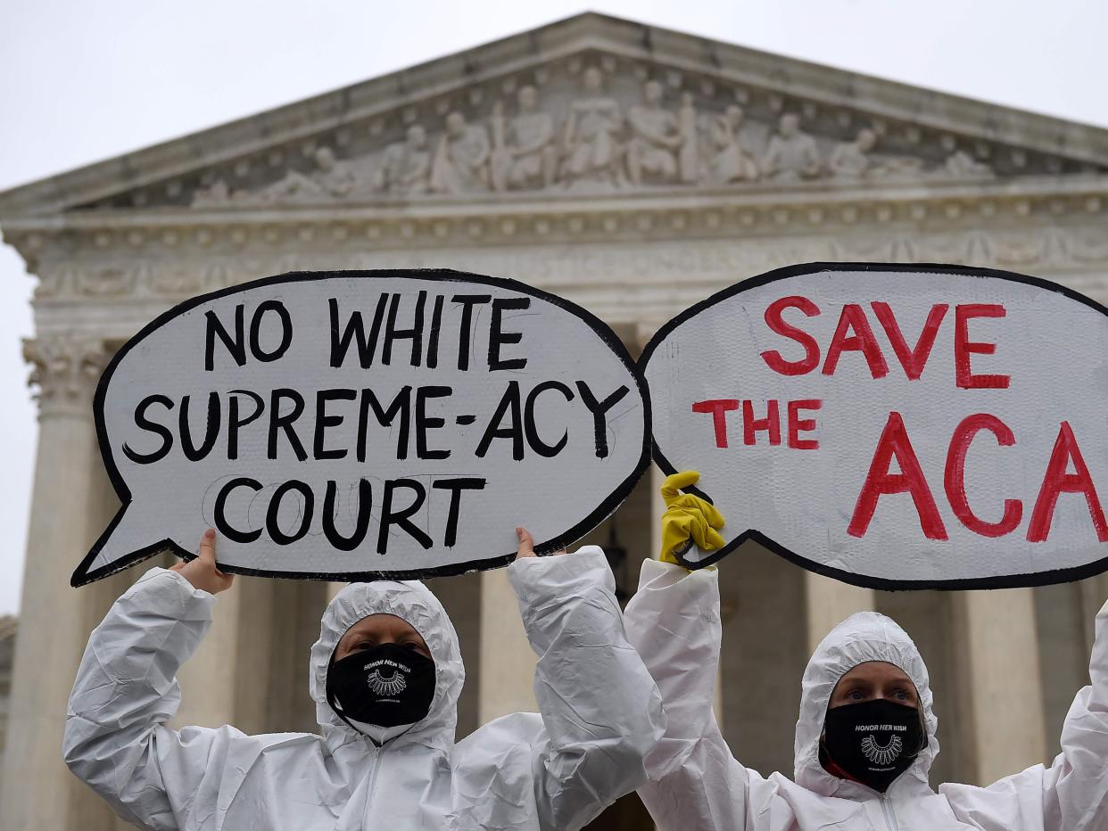 Members of Planned Parenthood protest in front of the Supreme Court on the first day of the nomination hearing for President Donald Trump's Supreme Court nominee, Amy Coney Barrett (AFP via Getty Images)