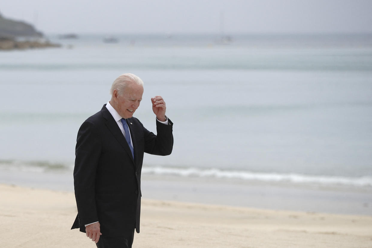 US President Joe Biden walks along the boardwalk during the G7 summit in Carbis Bay, Cornwall, south-west England on June 11, 2021. (Photo by PHIL NOBLE / POOL / AFP) (Photo by PHIL NOBLE/POOL/AFP via Getty Images)