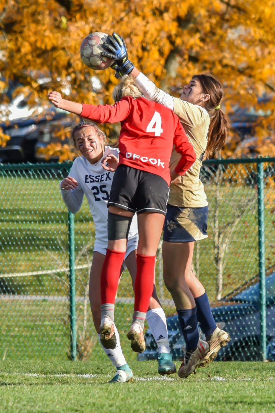 Essex goalie Kelsie Scanlon makes a leaping save during the Hornets' 2022 quarterfinal match against the CVU Redhawks.