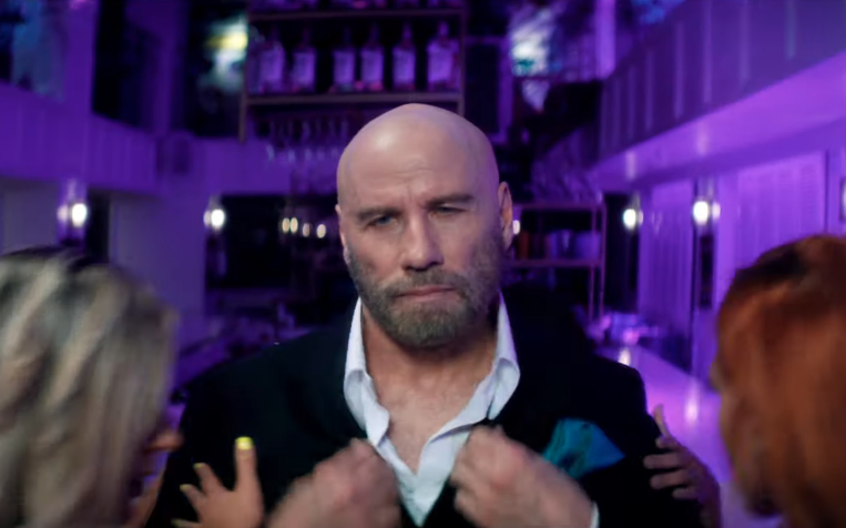 Travolta in the new Pitbull video (Credit: RCA)