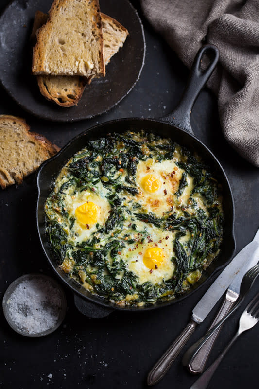 <p>Drizzle and Dip</p><p>Spinach is the perfect green to pair with an egg recipe. Add cream and buttery braised leeks to the mix and you are in for an indulgent treat.</p><p><strong>Get the recipe: <a href="https://drizzleanddip.com/2017/04/20/eggs-baked-in-creamy-spinach-and-leeks/" rel="nofollow noopener" target="_blank" data-ylk="slk:Eggs Baked in Creamy Spinach and Leeks;elm:context_link;itc:0;sec:content-canvas" class="link "><em>Eggs Baked in Creamy Spinach and Leeks</em></a></strong></p>