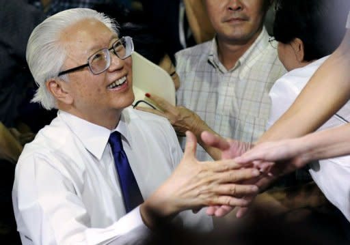 Former deputy prime minister Tony Tan secured victory after a recount in Singapore's presidential election on Sunday