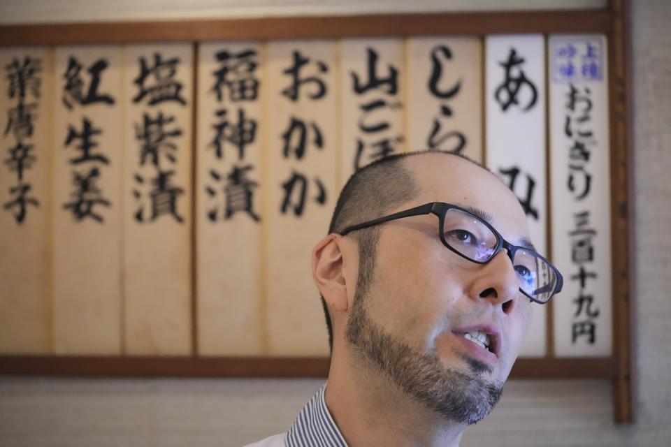 Yosuke Miura speaks at Onigiri Asakusa Yadoroku, Tokyo's oldest onigiri restaurant, on June 3, 2024, in Tokyo. The word "onigiri" just became part of the Oxford English Dictionary this year. The humble sticky-rice ball, a mainstay of Japanese food, has entered the global lexicon. (AP Photo/Eugene Hoshiko)