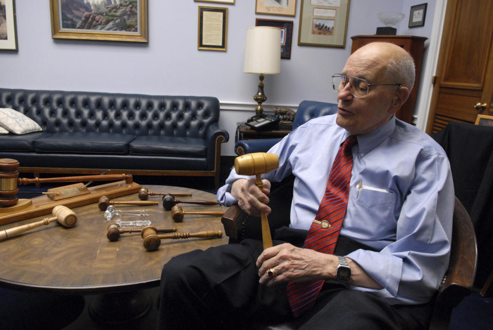 Dingell&nbsp;poses with his gavel collection in 2007.