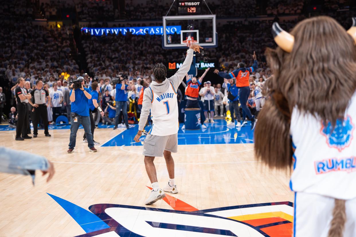 Jaylen O’Conner celebrates after hitting a halfcourt shot for $20,000 in prize money.