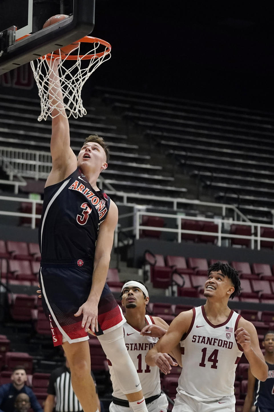 Arizona guard Pelle Larsson (3) shoots over Stanford forward Jaiden Delaire (11) and forward Spencer Jones (14) during the second half of an NCAA college basketball game in Stanford, Calif., Thursday, Jan. 20, 2022. (AP Photo/Jeff Chiu)