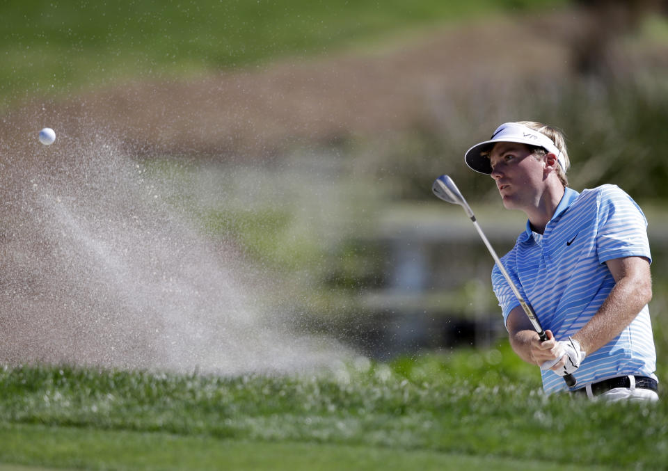 Russell Henley hits from a bunker onto the second green during the third round of the Honda Classic golf tournament, Saturday, March 1, 2014, in Palm Beach Gardens, Fla. (AP Photo/Wilfredo Lee)