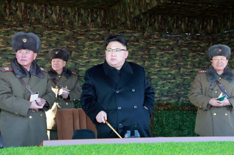 North Korean leader Kim Jong-Un (C) inspects a tactical military drill at an undisclosed location