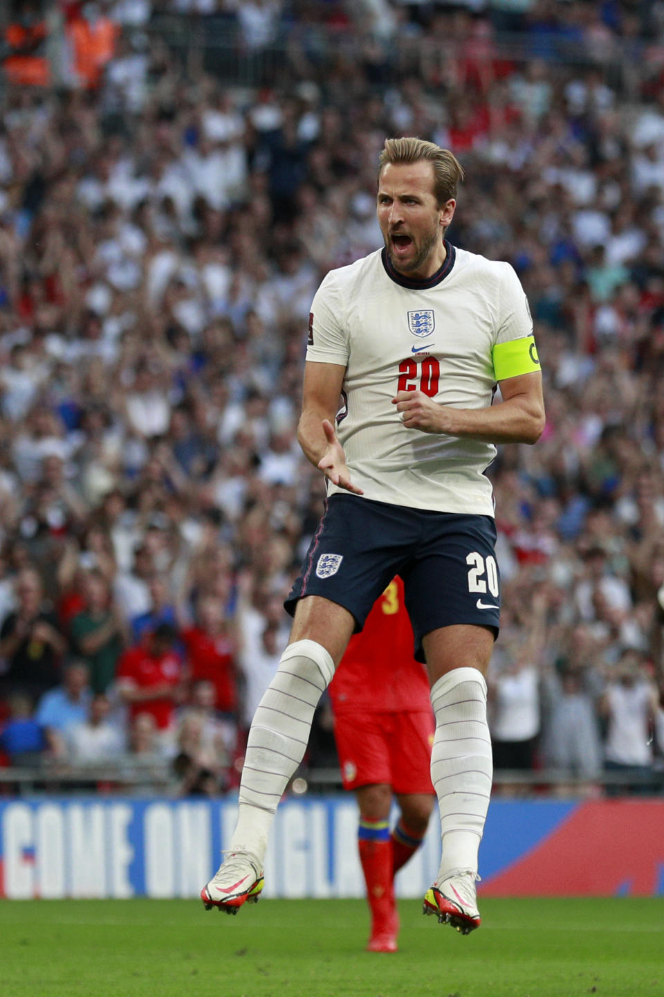 England's Harry Kane celebrates after scoring his side's second goal from the penalty spot during the World Cup 2022 group I qualifying soccer match between England and Andorra at Wembley stadium in London, Sunday, Sept. 5, 2021. (AP Photo/Ian Walton)