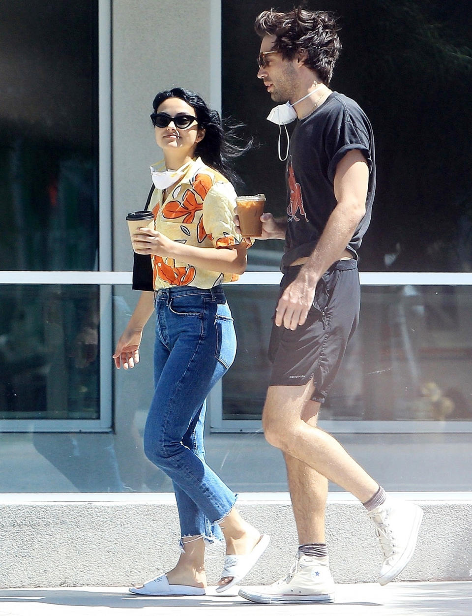 <p><i>Riverdale </i>actress Camila Mendes smiles with coffee in hand while out and about with a male friend in L.A. on Wednesday. </p>