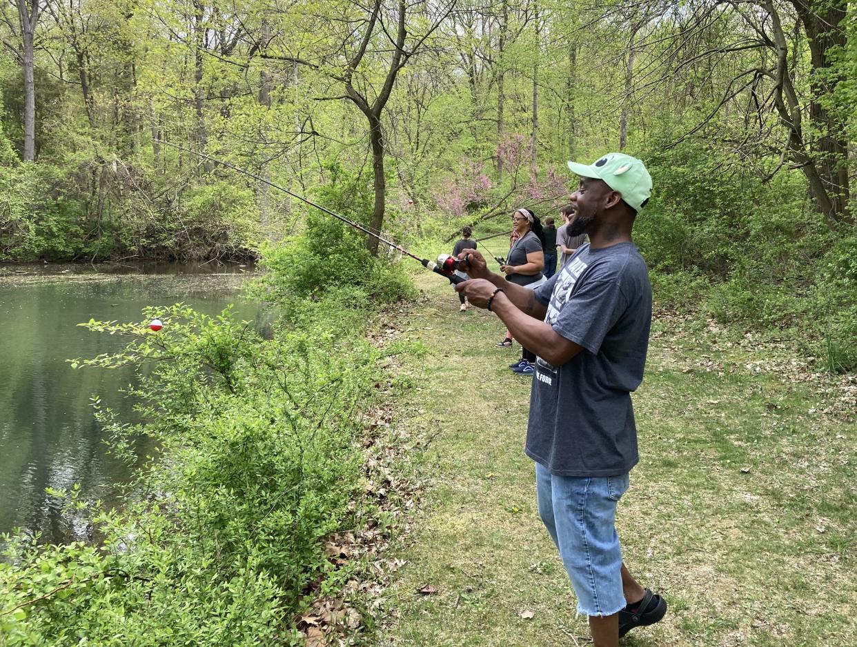 Visitors enjoy the annual free fishing day in June 2023 at the Izaak Walton League in South Bend.