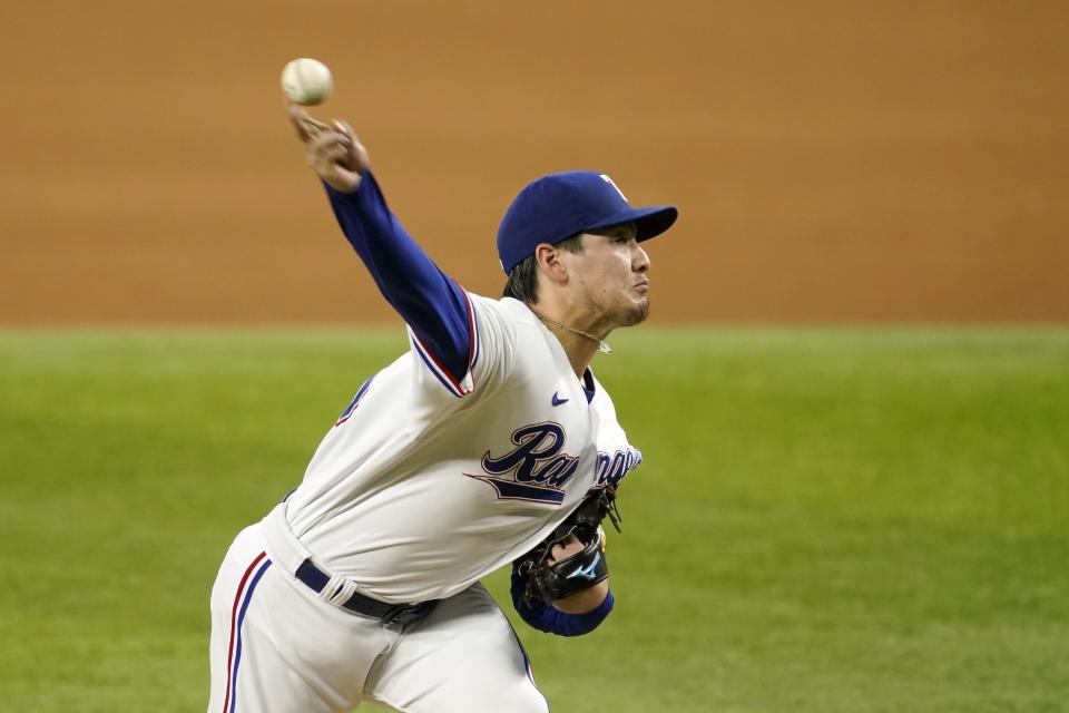 Texas Rangers starting pitcher Kohei Arihara throws in the third inning of a baseball game against the Houston Astros in Arlington, Texas, Wednesday, Sept. 15, 2021. (AP Photo/Tony Gutierrez)