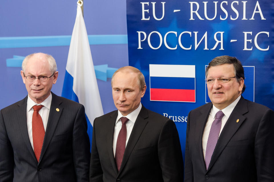 European Commission President Jose Manuel Barroso, right, Russian President Vladimir Putin, center, and European Council President Herman Van Rompuy pose for photographers at the European Council building in Brussels, on Tuesday, Jan. 28, 2014. Russian President Vladimir Putin and European Union leaders are weighing the future of their common relationship at a summit that was abridged amid stark differences over Ukraine's future and other issues. (AP Photo/Geert Vanden Wijngaert)