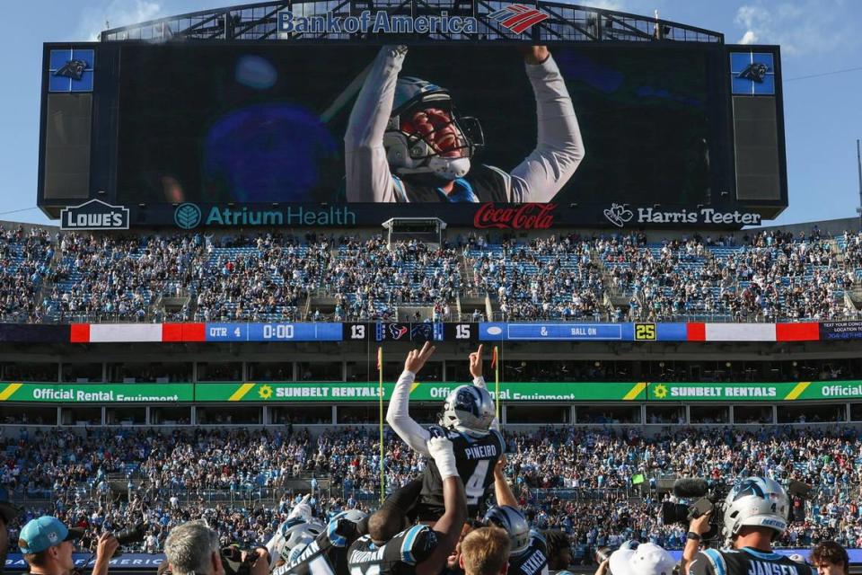 Carolina Panthers place kicker Eddy Pineiro, center, is hoisted by his teammates after making the winning field goal during the game against the Texans at Bank of America Stadium on Sunday, October 29, 2023. The Panthers beat the Texans, 15-13.