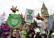 Climate change demonstrators march to demand curbs to carbon pollution in London on November 29, 2015 on the eve of the climate summit in Paris