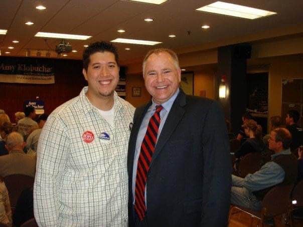 Now Minnesota Gov. Tim Walz (left) and campaign volunteer Jason Bauman (right) pose for a picture in 2006 in Winona, Minn.