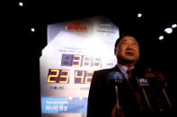 Lee Hee-beom, head of the Pyeongchang Organizing Committee for the 2018 Olympic and Paralympic Winter Games (POCOG), speaks in front of the Olympic countdown clock after its unveiling ceremony in Seoul, South Korea, February 8, 2017. REUTERS/Kim Hong-Ji