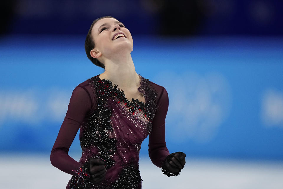 Anna Shcherbakova, of the Russian Olympic Committee, reacts after competing in the women's free skate program during the figure skating competition at the 2022 Winter Olympics, Thursday, Feb. 17, 2022, in Beijing. (AP Photo/David J. Phillip)