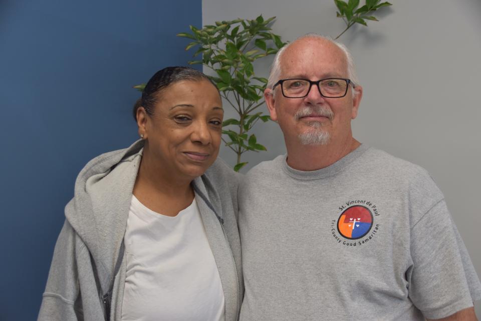 Tammie Hughes, left, poses with Tony Talbert at the Tri-County Good Samaritans St. Vincent de Paul conference’s new David’s House ministry in Richmond. The building was once a laundromat where Hughes’ sister was last seen in 2001 and has not been seen since.
