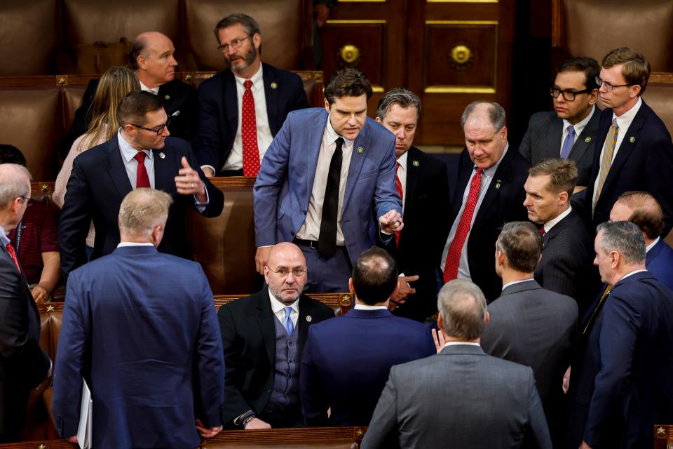 Florida Republican Matt Gaetz talks to fellow House members during the Speaker of the House voting at the U.S. Capitol Building last January.