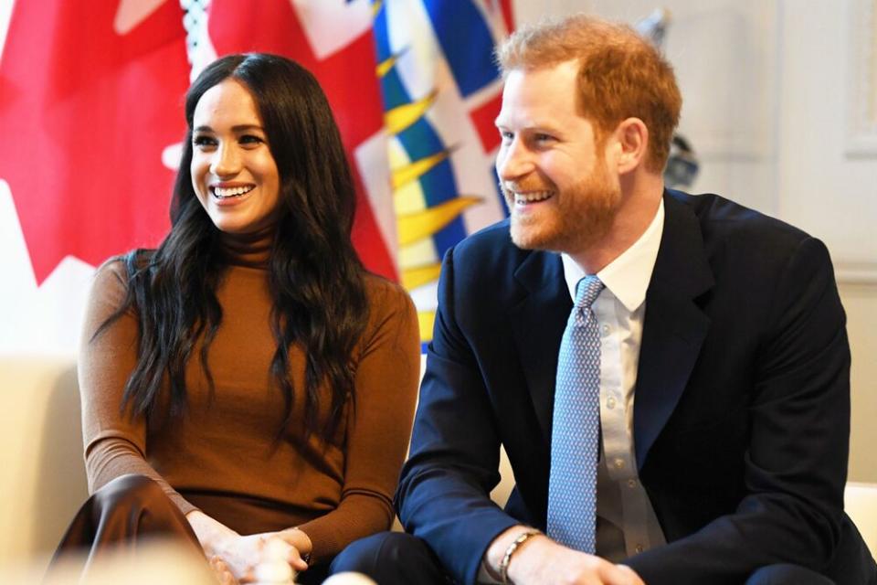The Duke and Duchess of Sussex react during their visit to Canada House in London on Jan. 7, 2020. | DANIEL LEAL-OLIVAS/AFP via Getty