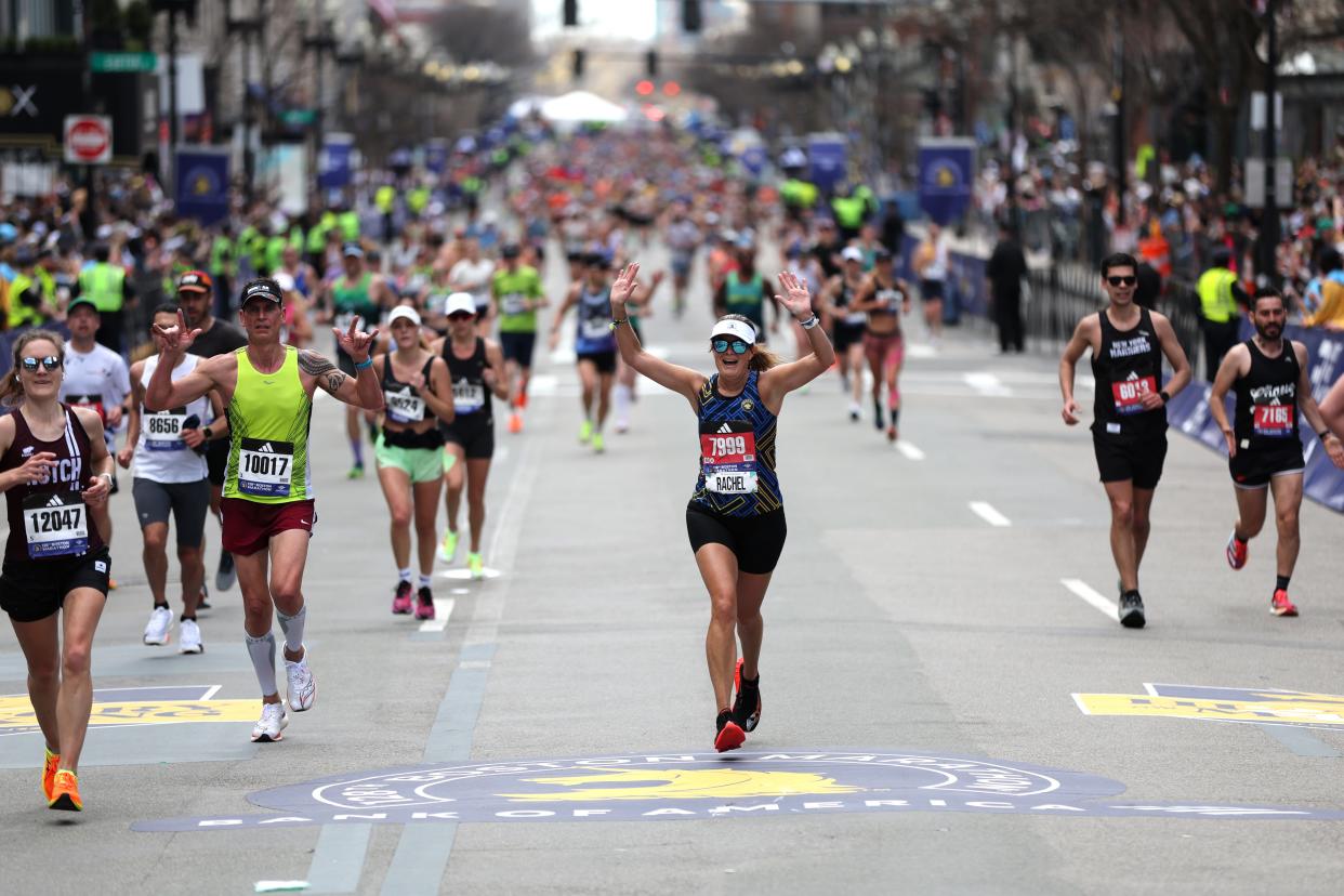 This is a photo of runners celebrating as they cross the finish line at this year's Boston Marathon. National Exercise Day is a great opportunity to look at running and other physical activity to hit the recommended 150-minute weekly goal.