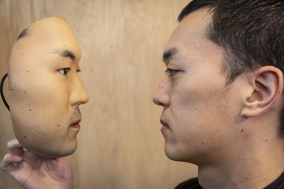 TOKYO, JAPAN - JANUARY 28: Shuhei Okawara, owner of mask shop Kamenya Omote, holding Hyper-realistic face mask poses for a portrait  on January 28, 2021 in Tokyo, Japan. The masks, made by Japanese retailer Kamenya Omote, are modelled on actual people who are paid 40,000 Yen for the right to use their face and are created on a 3D printer before being sold for up to 98,000 Yen. Although providing quite a party piece, unfortunately they donâ€™t offer protection from coronavirus. (Photo by Yuichi Yamazaki/Getty Images)