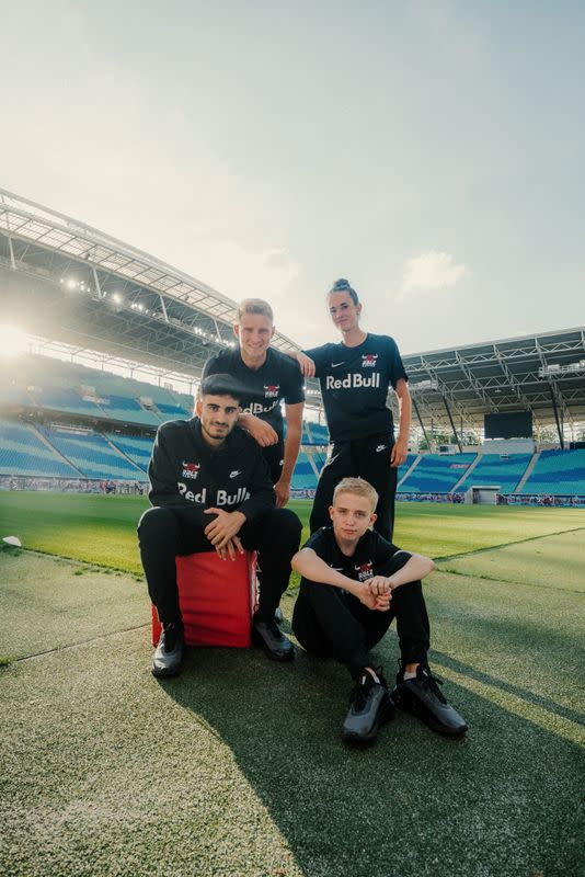 FIFA 21 gamer Anders Vejrgang poses for a photo with his team members of the RB Leipzig Gaming at the Red Bull Arena in Leipzig