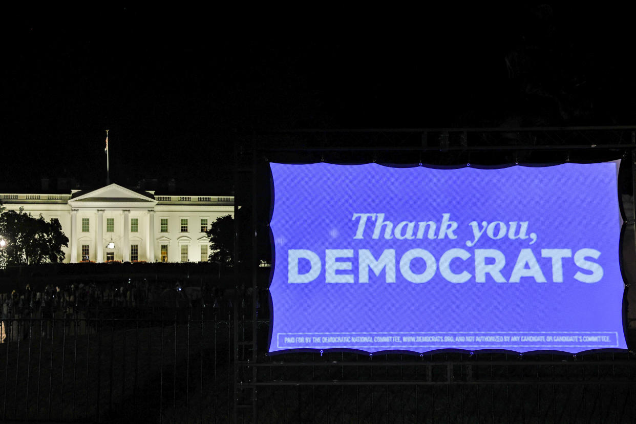 WASHINGTON, DC - AUGUST 12: A projection display thanking democrats for the passage of the Inflation Reduction Act is displayed in front of the White House on August 12, 2022 in Washington, DC. (Photo by Jemal Countess/Getty Images for DNC)